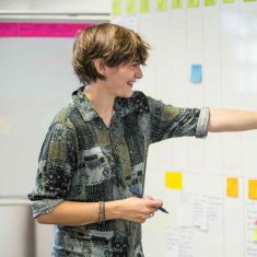 Cathy Dutton adding sticky to whiteboard