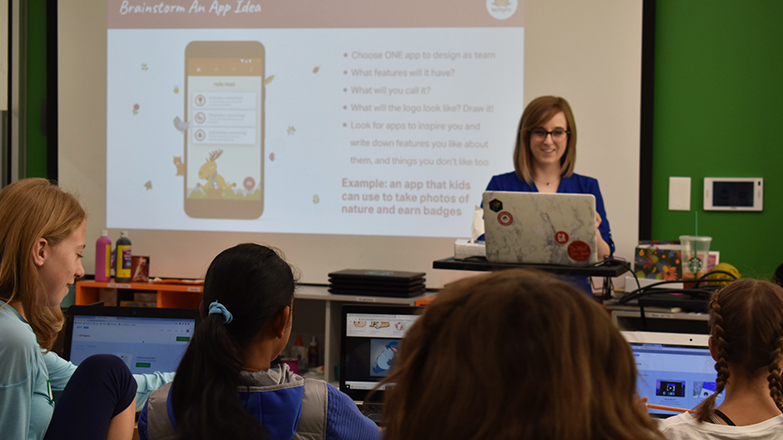 Anna presenting to classroom of kids