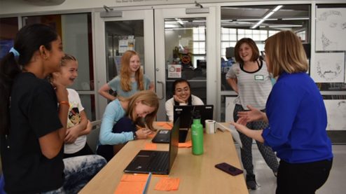 Anna working with students