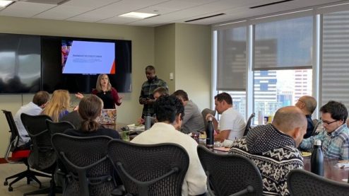 Anna E. Cook and Aaron Middleton speaking to group