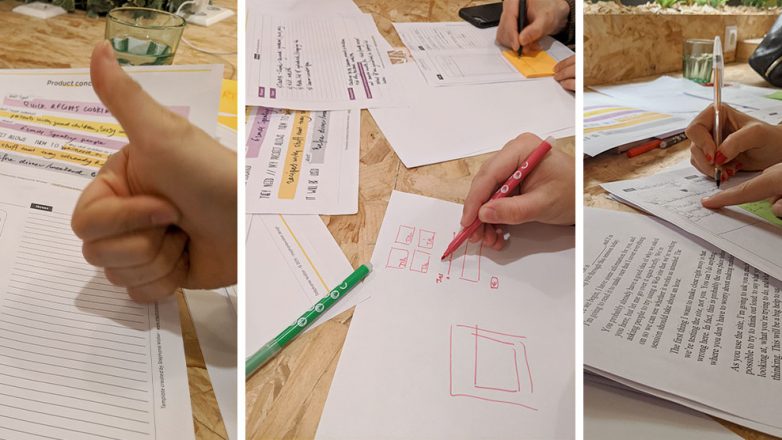 People during the workshop drawing paper wireframes, testing the concept
